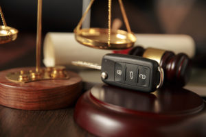 Car Accident Lawyer Charlotte, NC - Wooden referee hammer and car keys